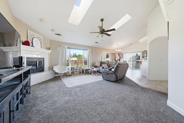 a living room with furniture and a fireplace