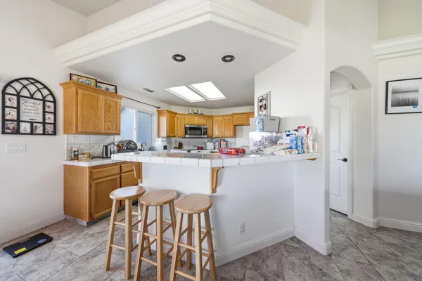 a kitchen with a sink cabinets and window