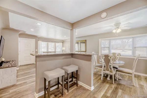 a view of a dining room with furniture window and outside view