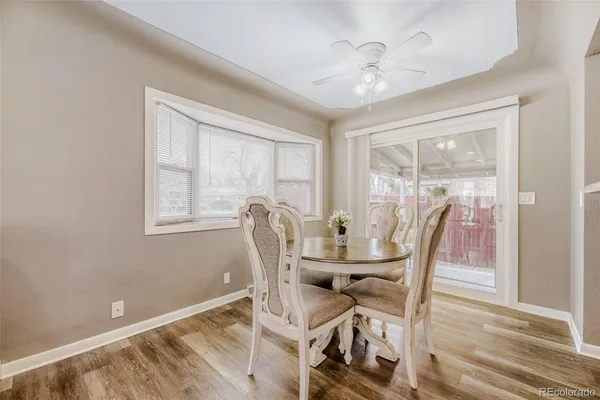a view of a dining room with furniture window and wooden floor