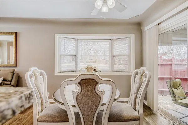 a view of a dining room with furniture window and outside view