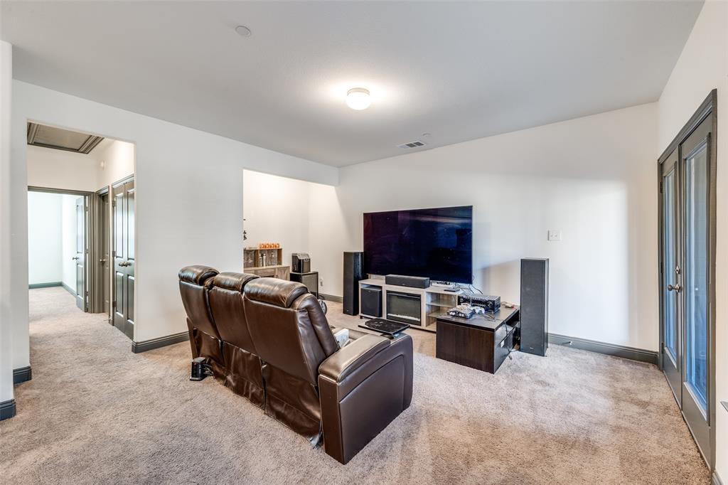 8132 Foraker Street Frisco, TX 75034 - Photo 15 of 25 Living area with light carpet and baseboards