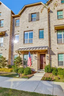 a front view of a building with garden