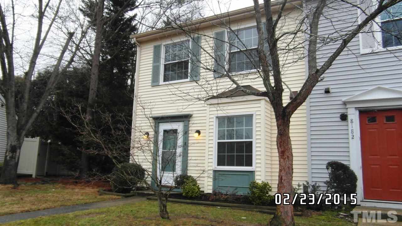 8184 McGuire Drive Raleigh, NC 27616 - Photo 2 of 23 a front view of a house with a yard garage and outdoor seating