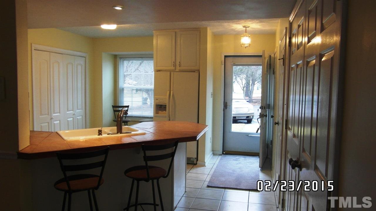 8184 McGuire Drive Raleigh, NC 27616 - Photo 7 of 23 a kitchen with a table and chairs in it