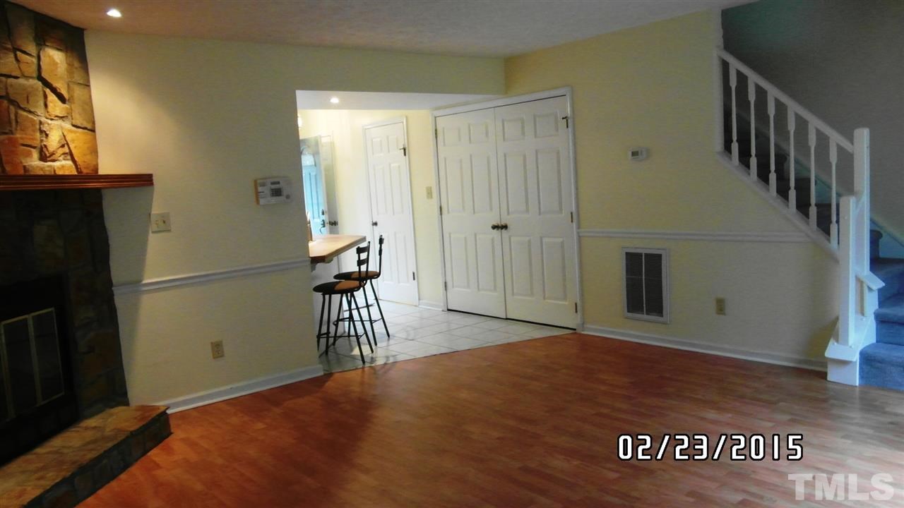 8184 McGuire Drive Raleigh, NC 27616 - Photo 9 of 23 a view of empty room with wooden floor and fan