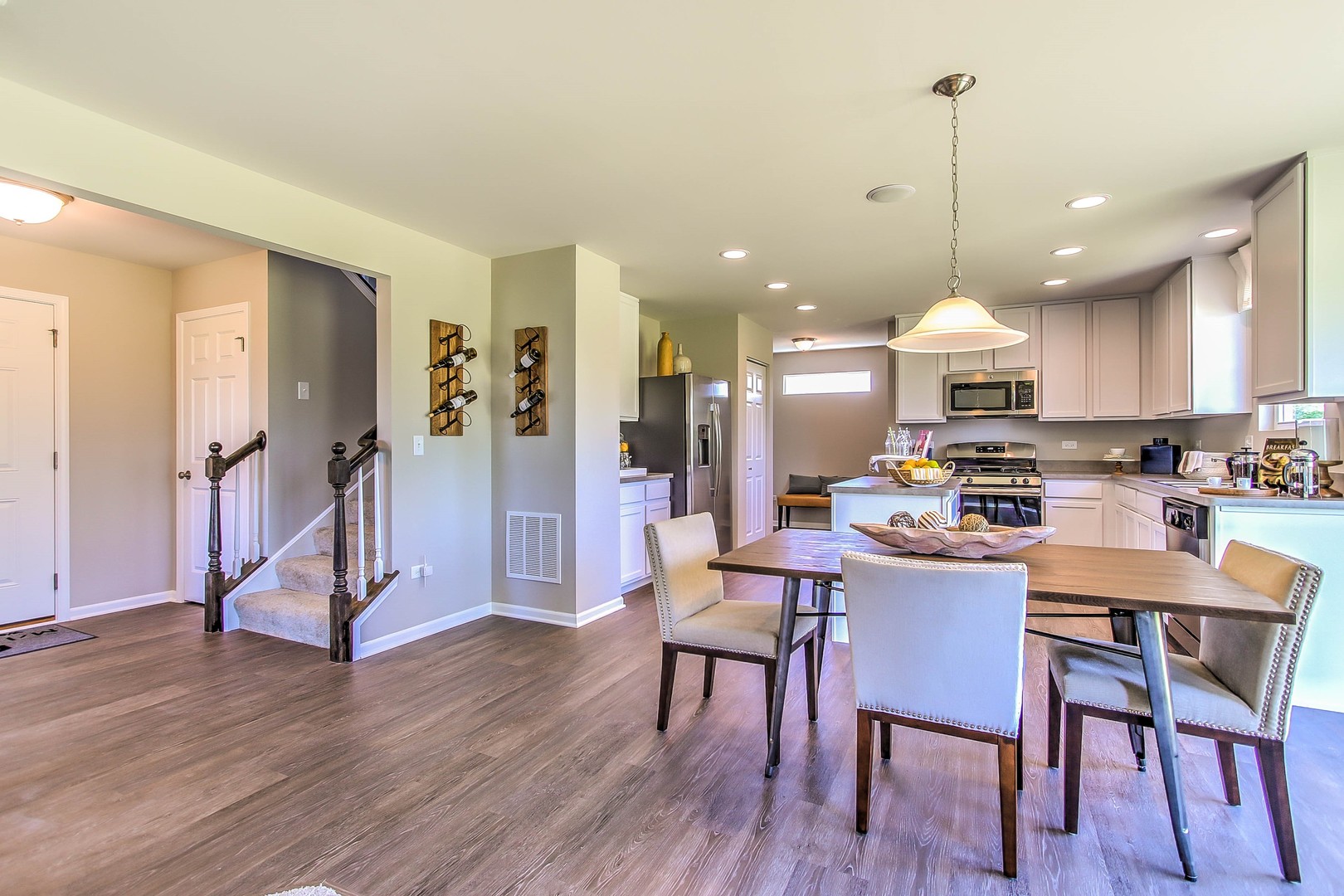 1030 Sharp Drive Plano, IL 60545 - Photo 13 of 36 a view of a kitchen with dining table and chairs