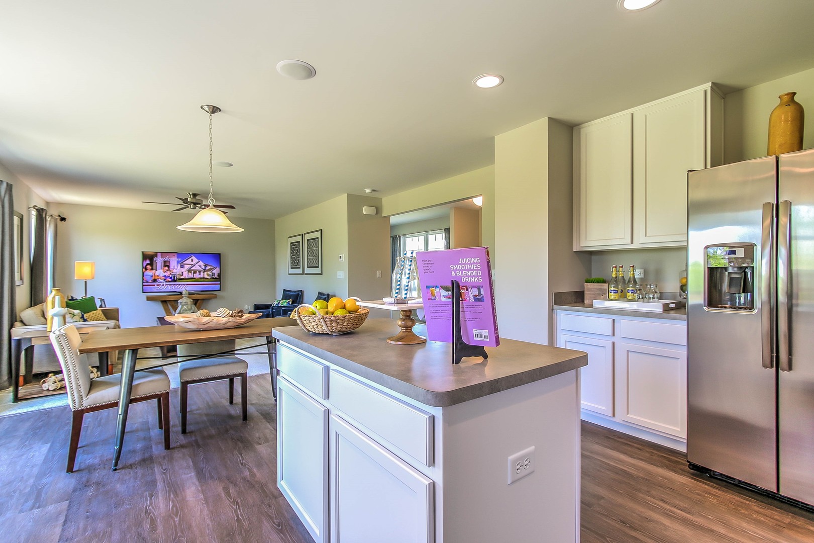 1030 Sharp Drive Plano, IL 60545 - Photo 19 of 36 a kitchen with stainless steel appliances granite countertop a stove a sink dishwasher a refrigerator white cabinets and wooden floor