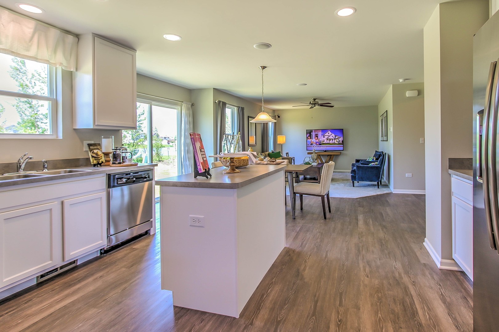 1030 Sharp Drive Plano, IL 60545 - Photo 20 of 36 a kitchen that has a lot of cabinets a sink and appliances in it
