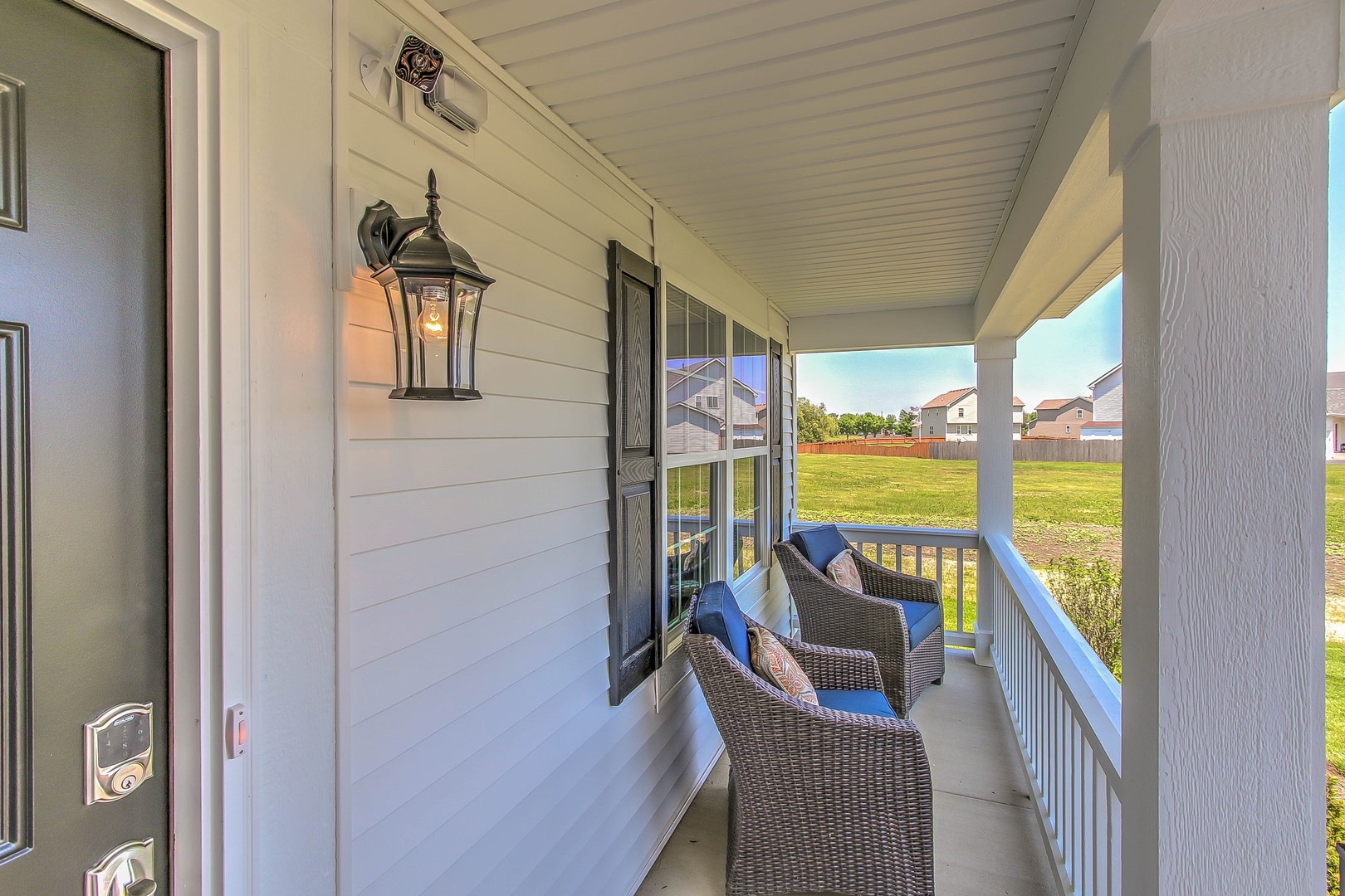1030 Sharp Drive Plano, IL 60545 - Photo 2 of 36 a living room with furniture and a floor to ceiling window
