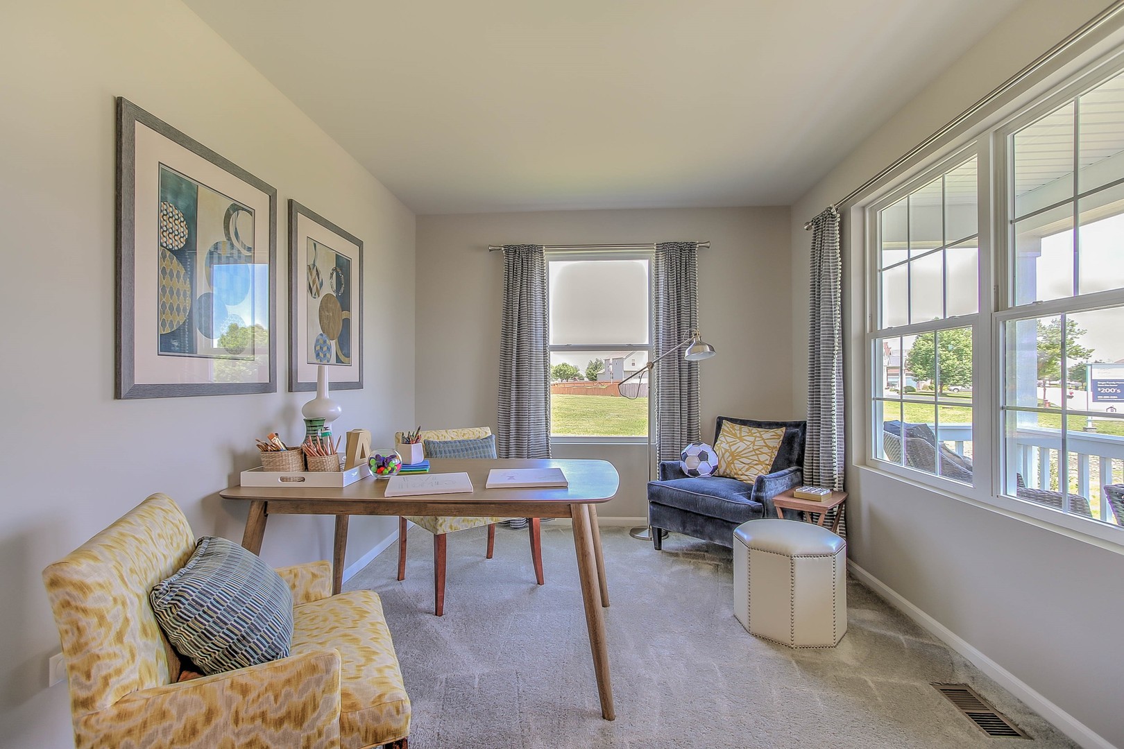 1030 Sharp Drive Plano, IL 60545 - Photo 4 of 36 a living room with furniture and floor to ceiling windows