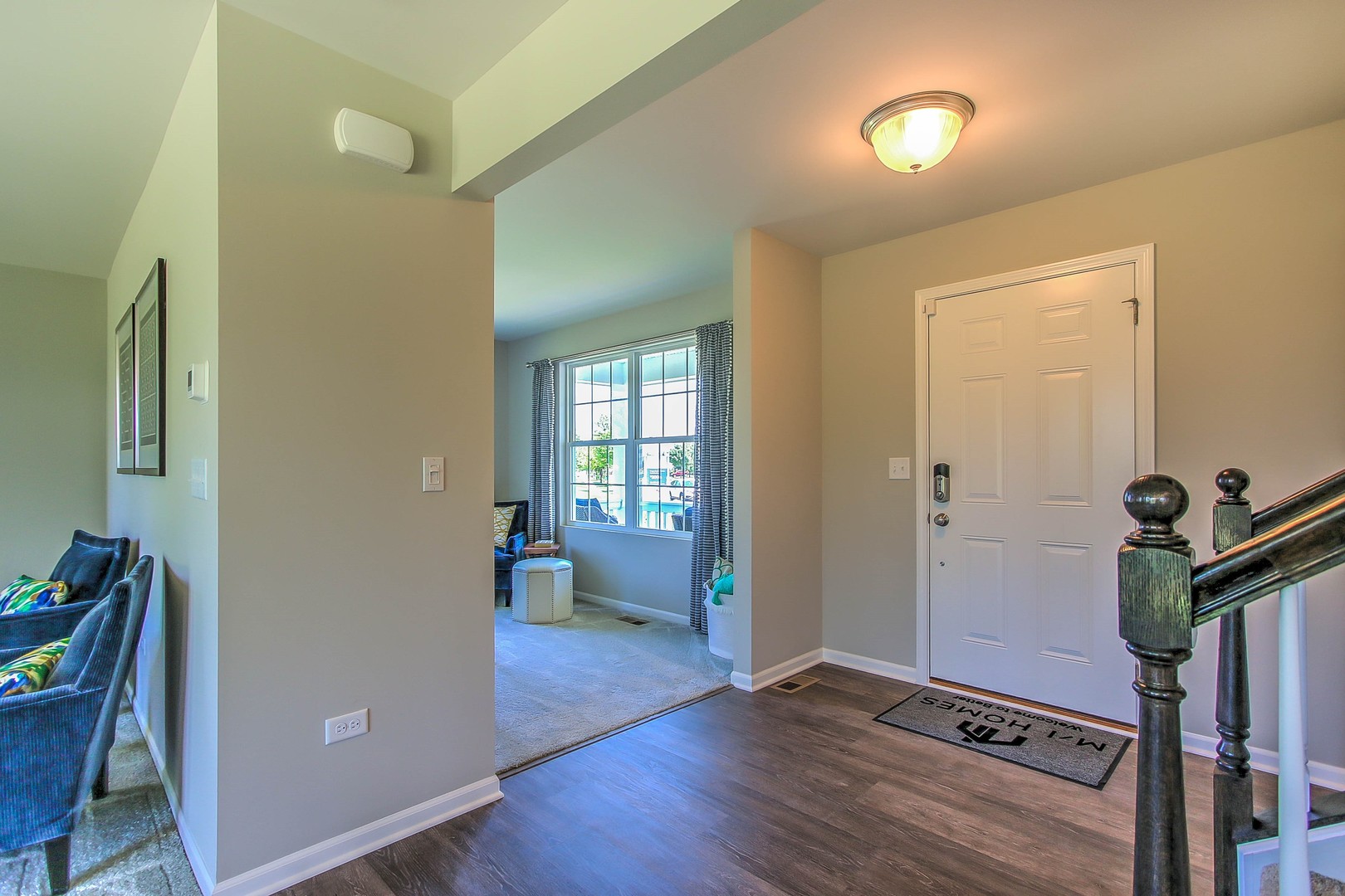 1030 Sharp Drive Plano, IL 60545 - Photo 6 of 36 a view of a hallway with wooden floor and furniture