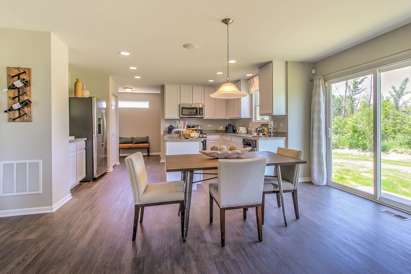 1030 Sharp Drive Plano, IL 60545 - Photo 10 of 36 a view of a dining room with furniture window and wooden floor