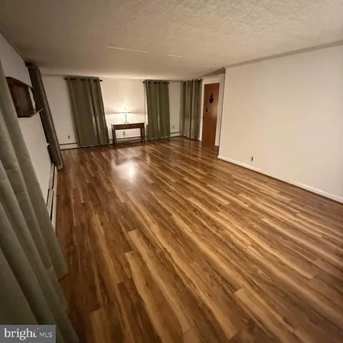 a room with a sink and cabinets