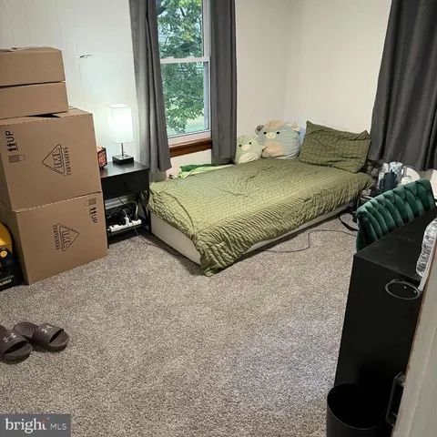 a room with furniture and musical instruments