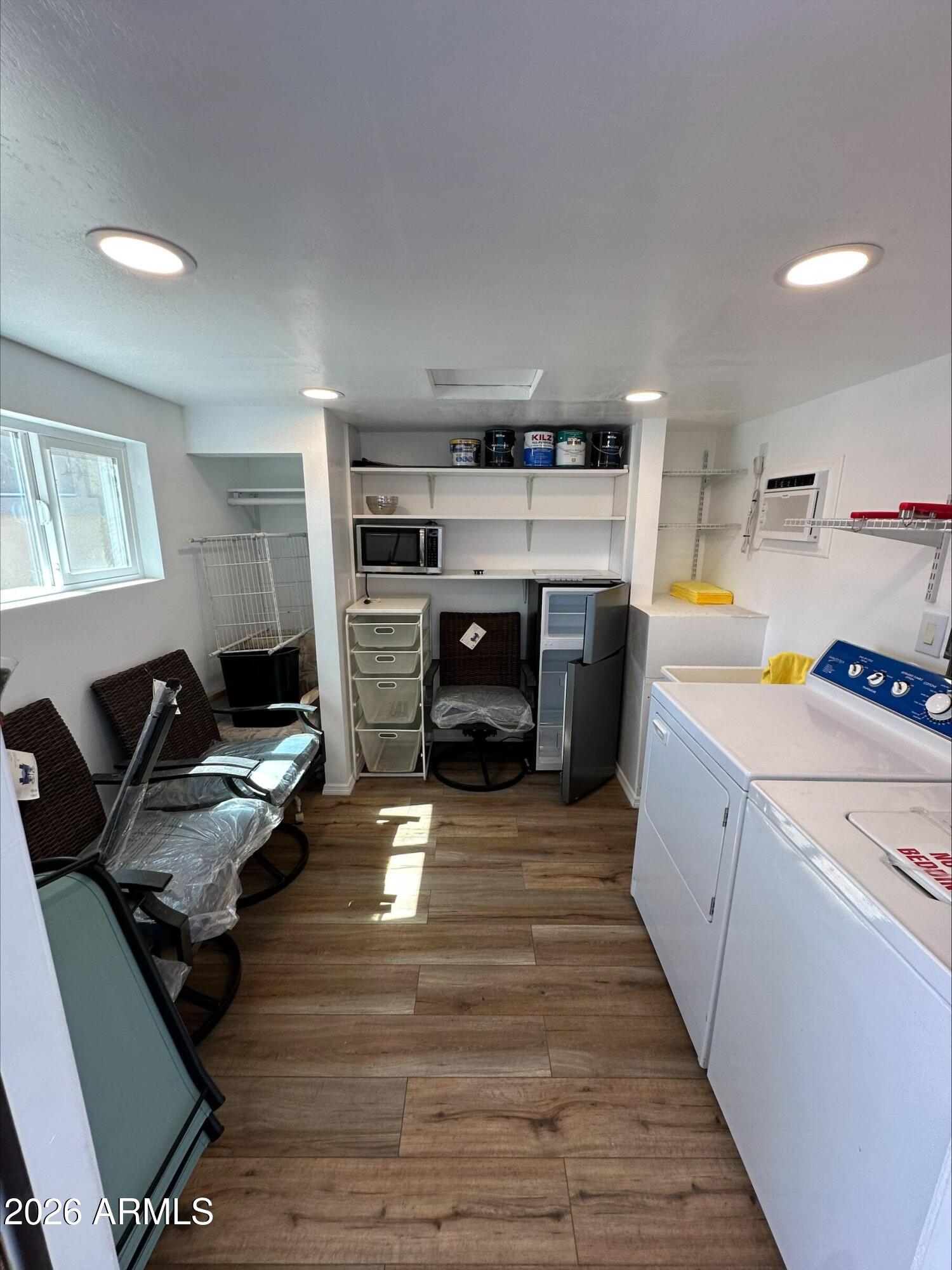 17200 West Bell Road, Unit 1104 Surprise, AZ 85374 - Photo 4 of 6 a bed room with furniture and a fireplace