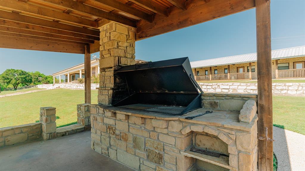 175 Tobacco Road Whitney, TX 76692 - Photo 25 of 35 View of storm shelter with a lawn