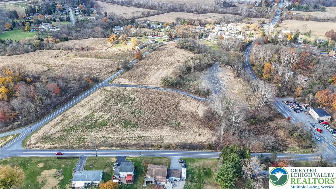 4828 Huckleberry Road Orefield, PA 18069 - Photo 11 of 41 a roof view covered with large trees