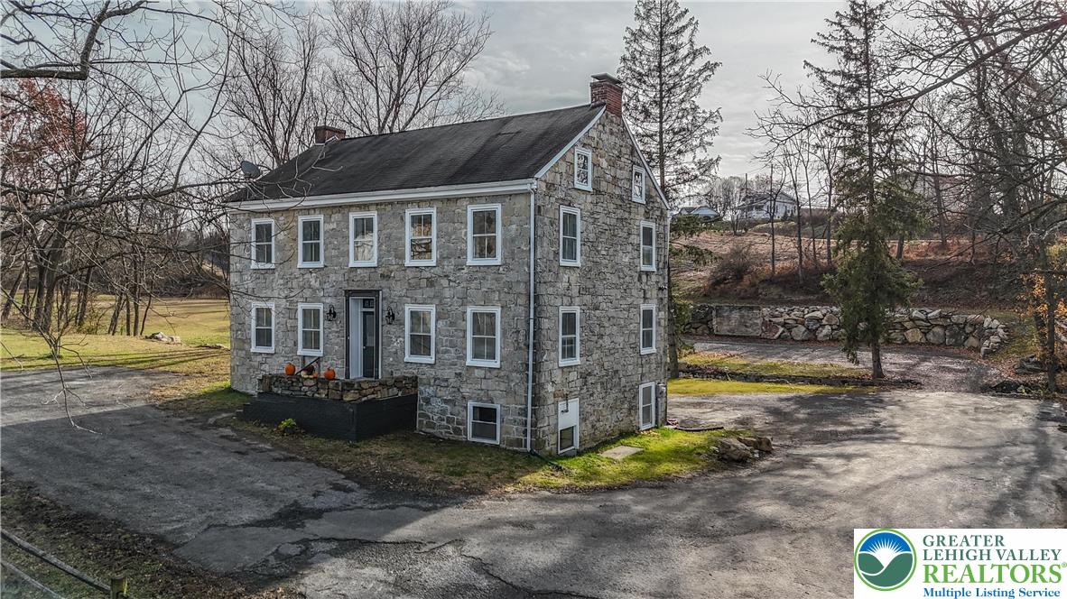 4828 Huckleberry Road Orefield, PA 18069 - Photo 13 of 41 a view of a house with a yard covered with snow in the yard