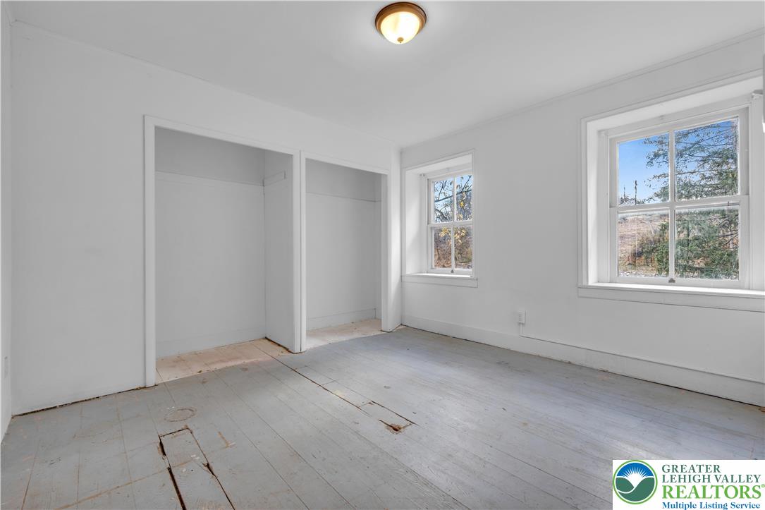 4828 Huckleberry Road Orefield, PA 18069 - Photo 18 of 41 an empty room with windows and closet