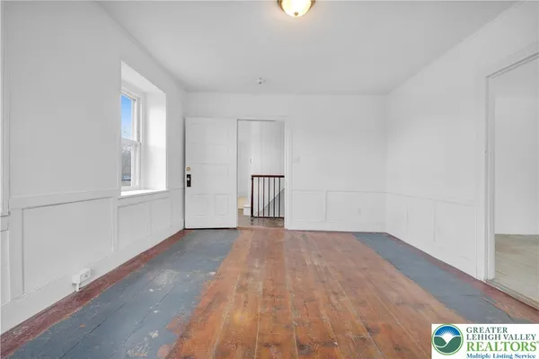 an empty room with windows