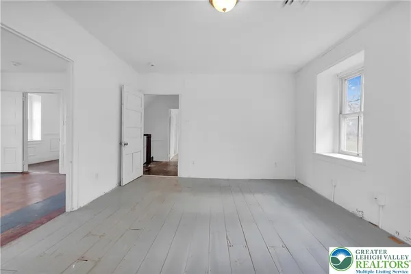 a view of a dining room with furniture and window