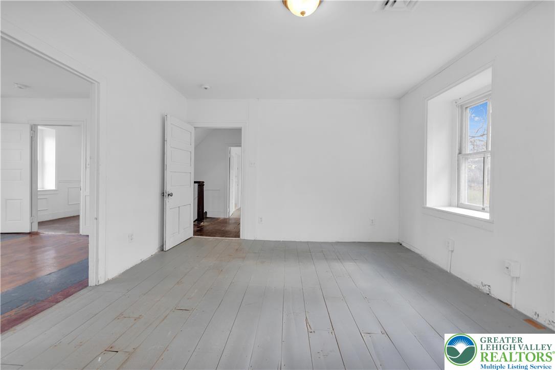 4828 Huckleberry Road Orefield, PA 18069 - Photo 28 of 41 wooden floor in an empty room with a window