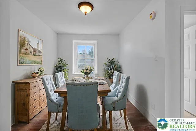 a bedroom with a bed and a potted plant