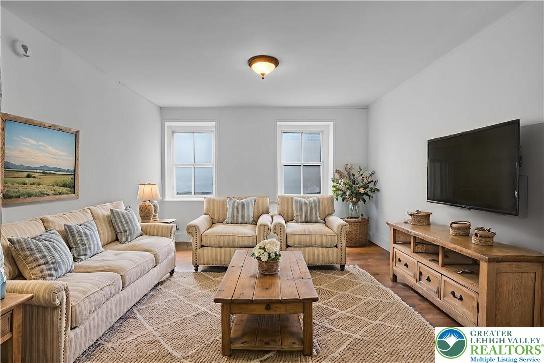 4828 Huckleberry Road Orefield, PA 18069 - Photo 31 of 41 a living room with furniture and a flat screen tv