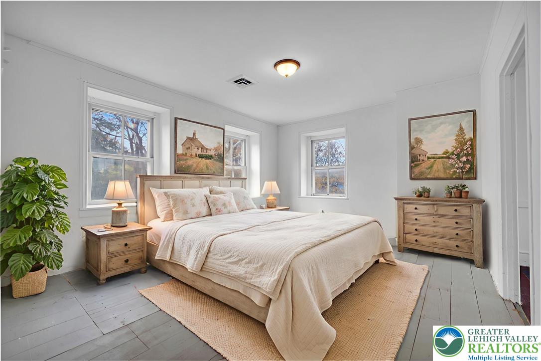 4828 Huckleberry Road Orefield, PA 18069 - Photo 34 of 41 a bedroom with a bed and a painting on the wall