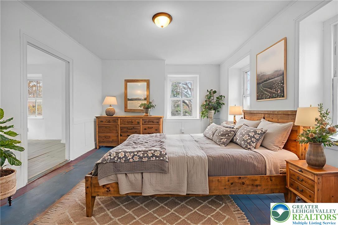 4828 Huckleberry Road Orefield, PA 18069 - Photo 35 of 41 a bedroom with a bed and a dresser next to a window