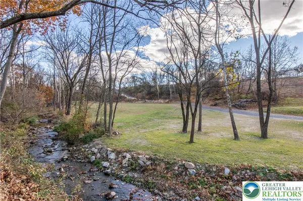 a view of a yard with swimming pool