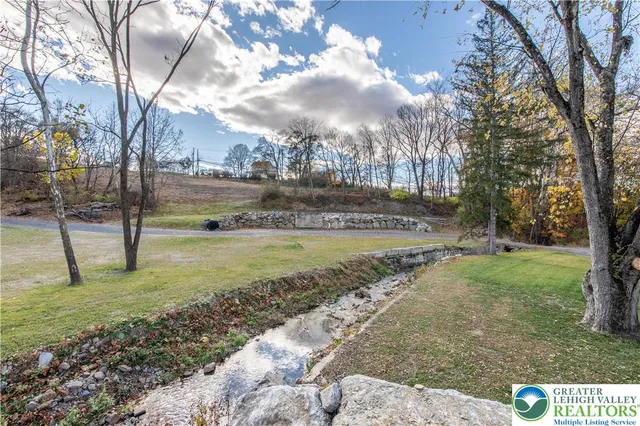a view of balcony with wooden floor and fence