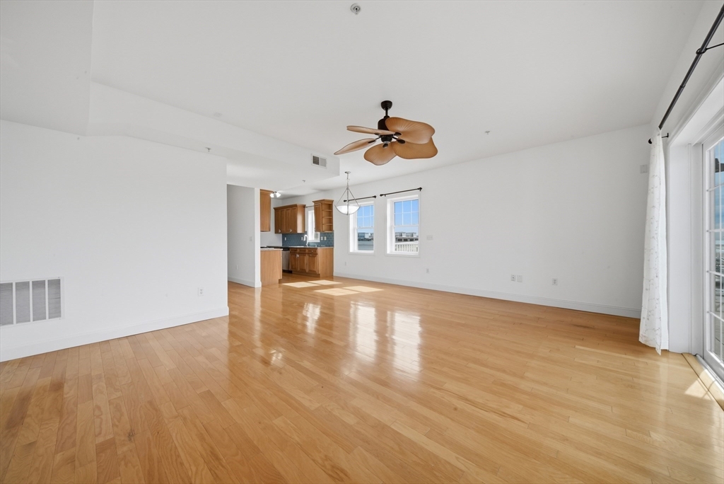 233 Beach Road, Unit A11 Salisbury, MA 01952 - Photo 12 of 37 a view of empty room with wooden floor