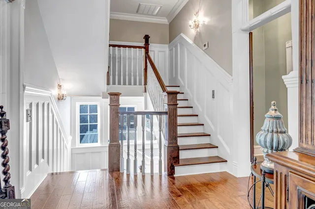 a view of a house with a yard and tree s