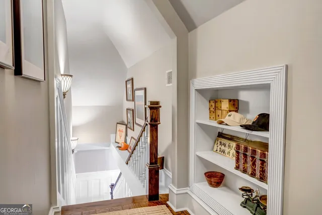 a view of a patio with table and chairs potted plants with wooden floor and fence