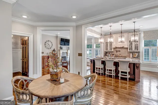 a front view of a house with a yard table and chairs