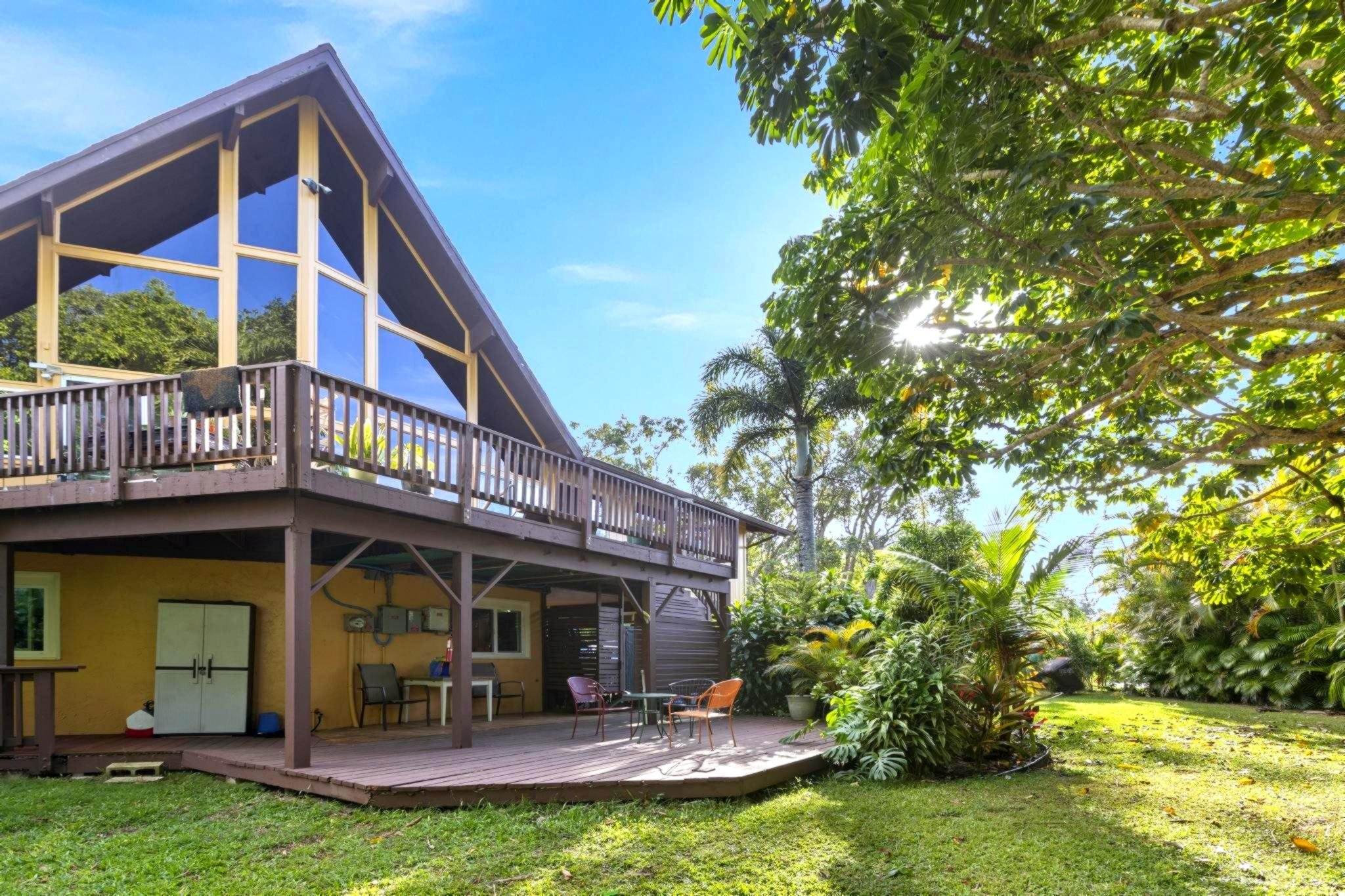 105 East Kuiaha Road Haiku, HI 96708 - Photo 4 of 24 a view of a house with a yard balcony and sitting area