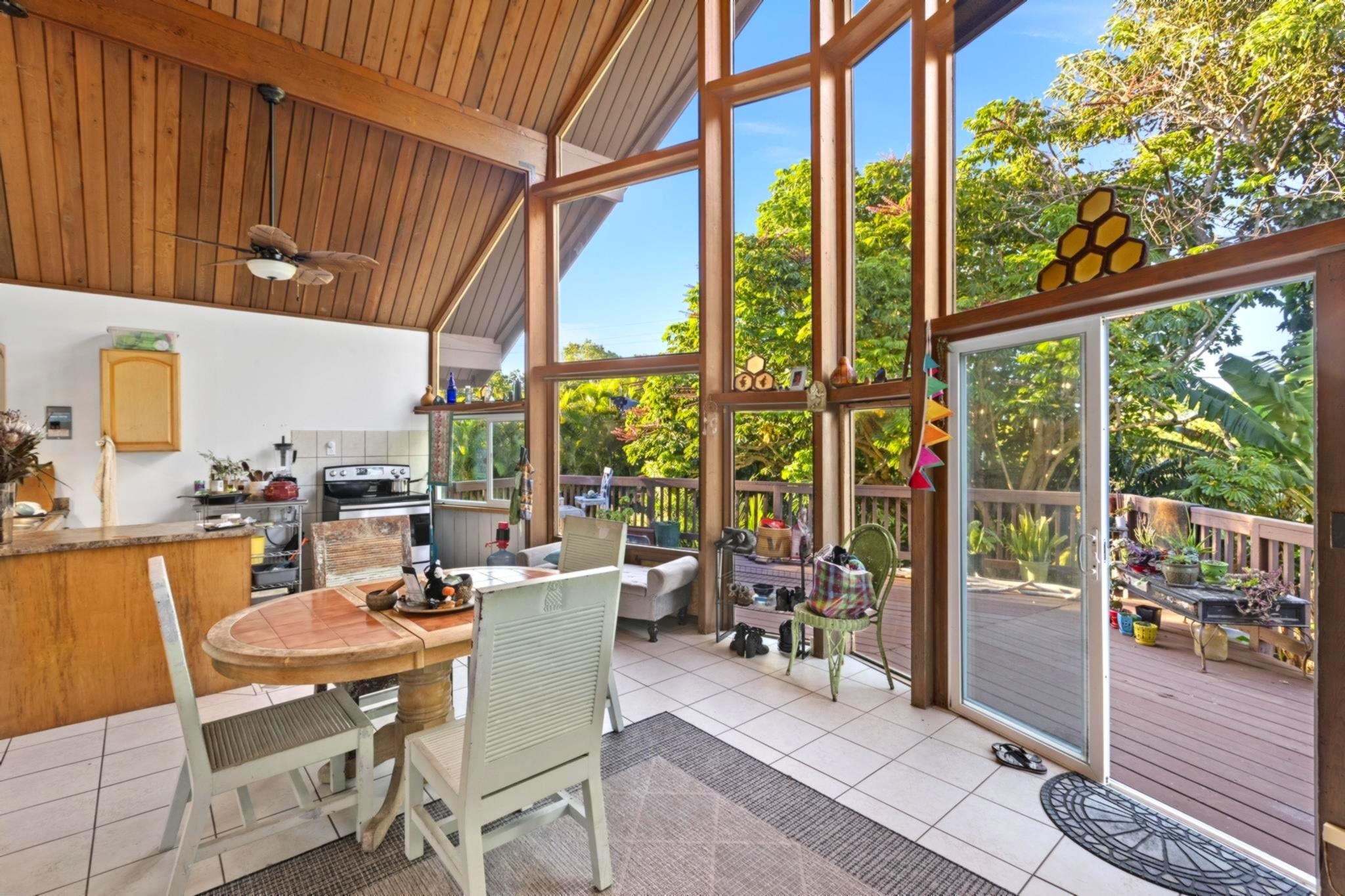 105 East Kuiaha Road Haiku, HI 96708 - Photo 7 of 24 a dining room with furniture and a floor to ceiling window