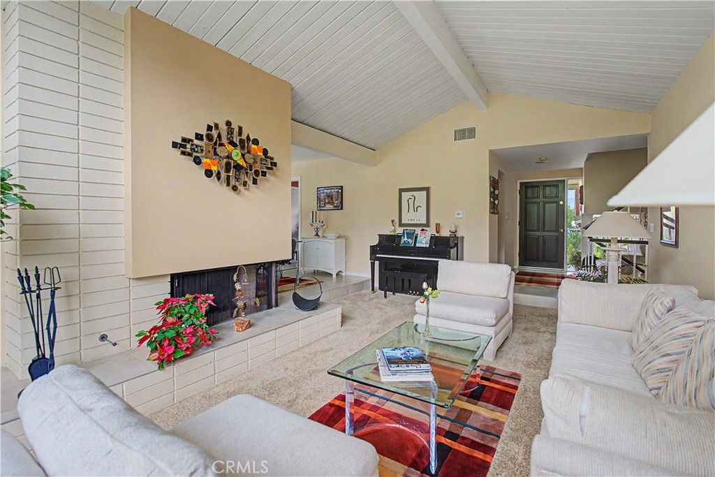 22671 Town Crier Road Calabasas, CA 91302 - Photo 28 of 35 a living room with furniture and a potted plant