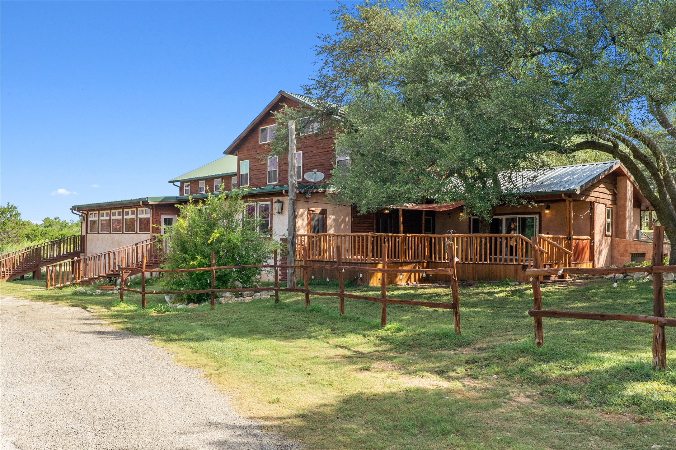 4032 Ranch Road 3232 Johnson City, TX 78636 - Photo 2 of 40 The main lodge is over 5,500 sf set in a grove of oaks and overlooking the organic orchard