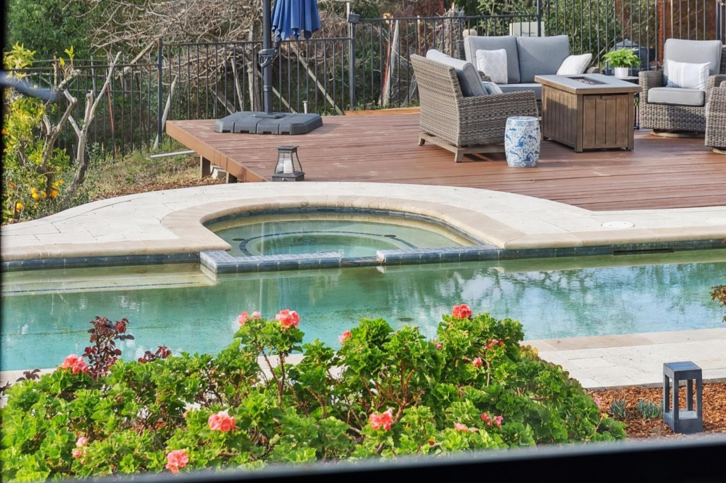 600 Ridge Top Road Los Gatos, CA 95033 - Photo 25 of 81 a view of a fountain in the backyard of a house