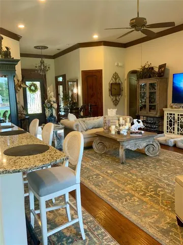 a living room with fireplace furniture and a flat screen tv