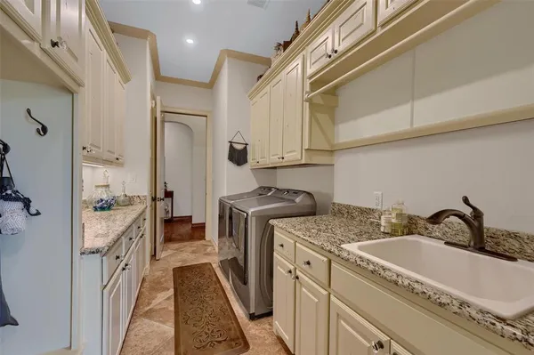 a bathroom with a granite countertop sink a toilet and a mirror