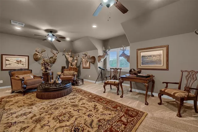 a living room with furniture a rug and a chandelier