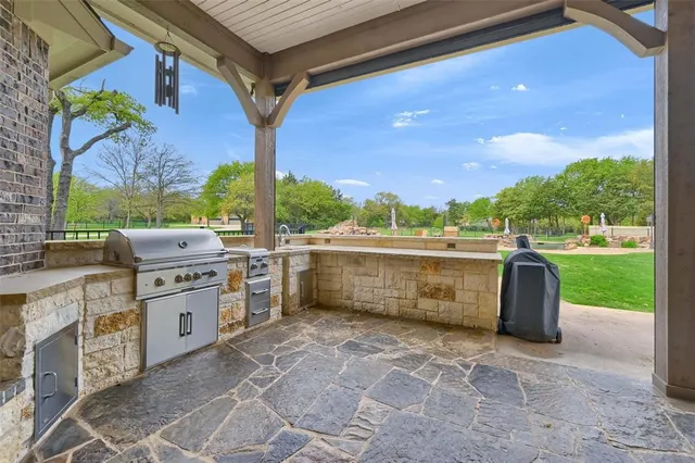 a view of a kitchen with a sink and a stove