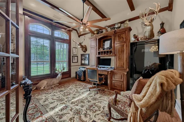 a view of a livingroom with furniture and a window