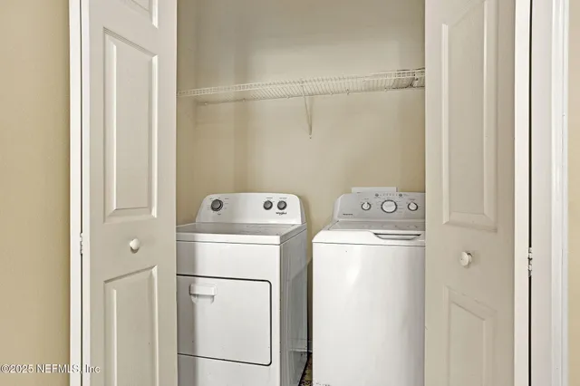 a utility room with dryer and washer