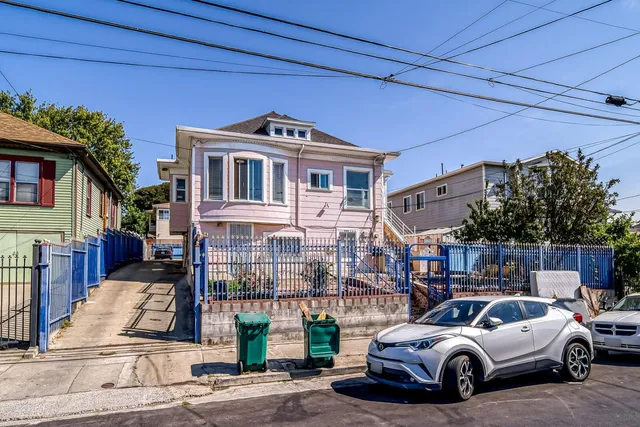 a view of a car parked in front of a house