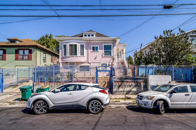 a front view of a house with parking space